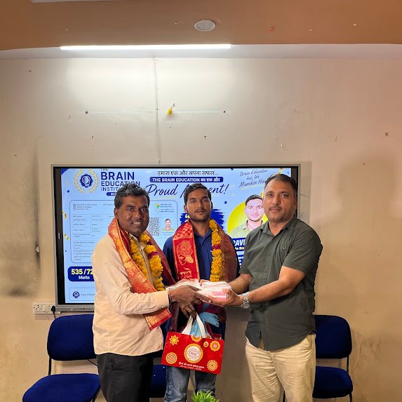 Ravi Kushwah, NEET 2026 qualifier, with faculty of The Brain Education Institute Morena
